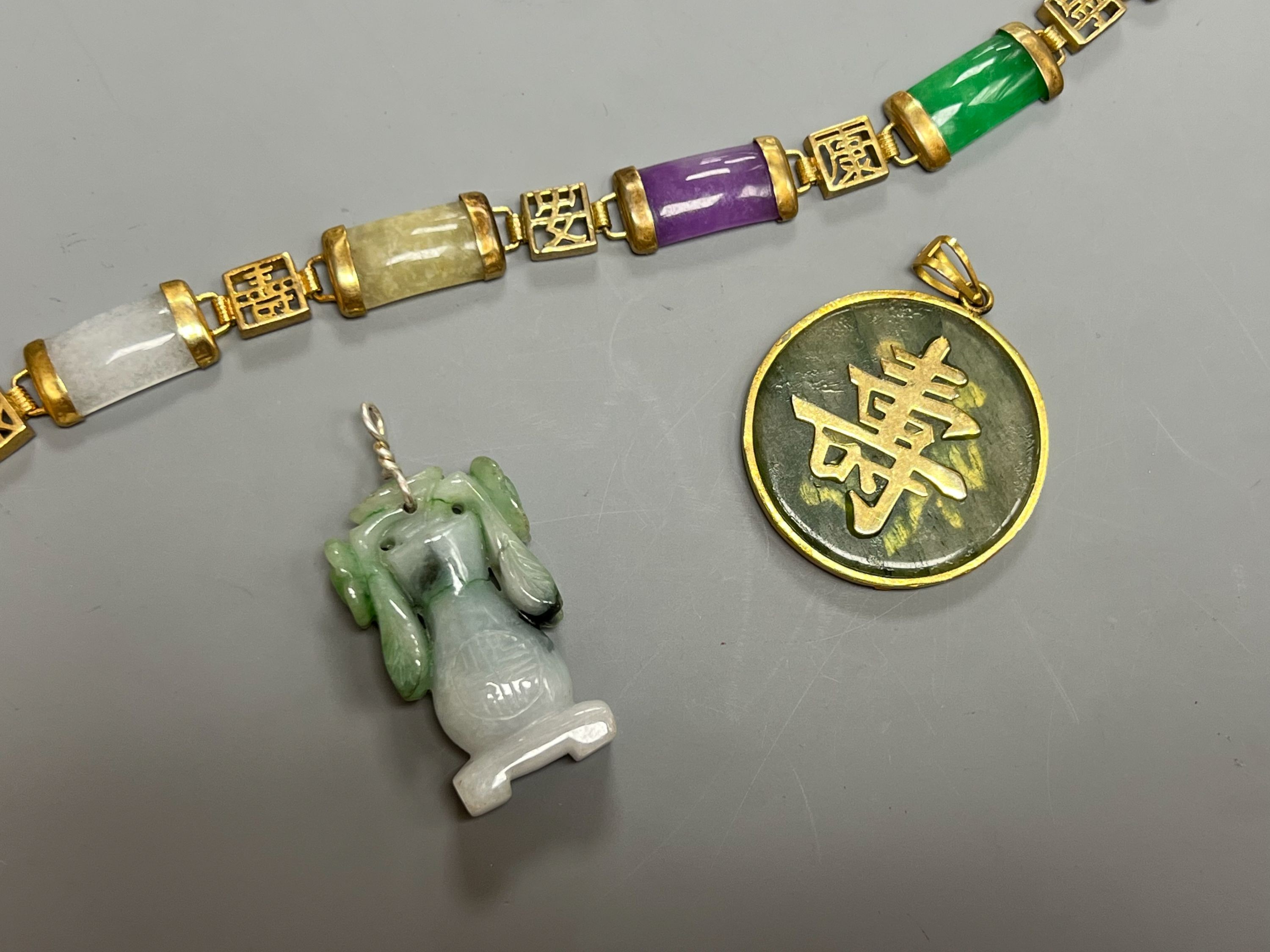 A Chinese multi coloured jadeite bracelet, and two jadeite pendants